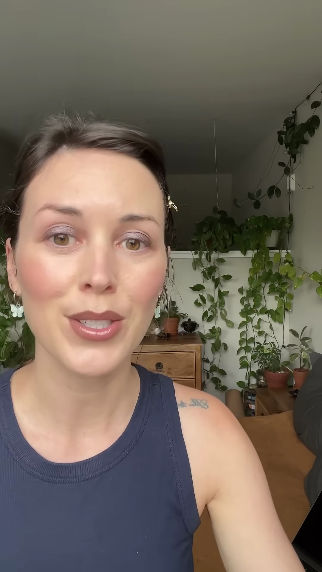 Creator smiling happily showing off the perfect MAC Stone lip look