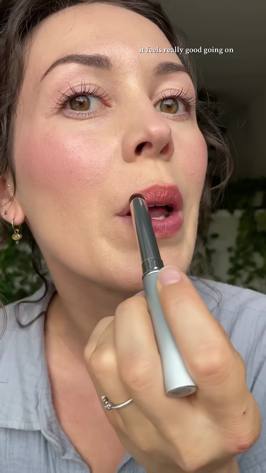Abby applying Clinique Black Honey lipstick