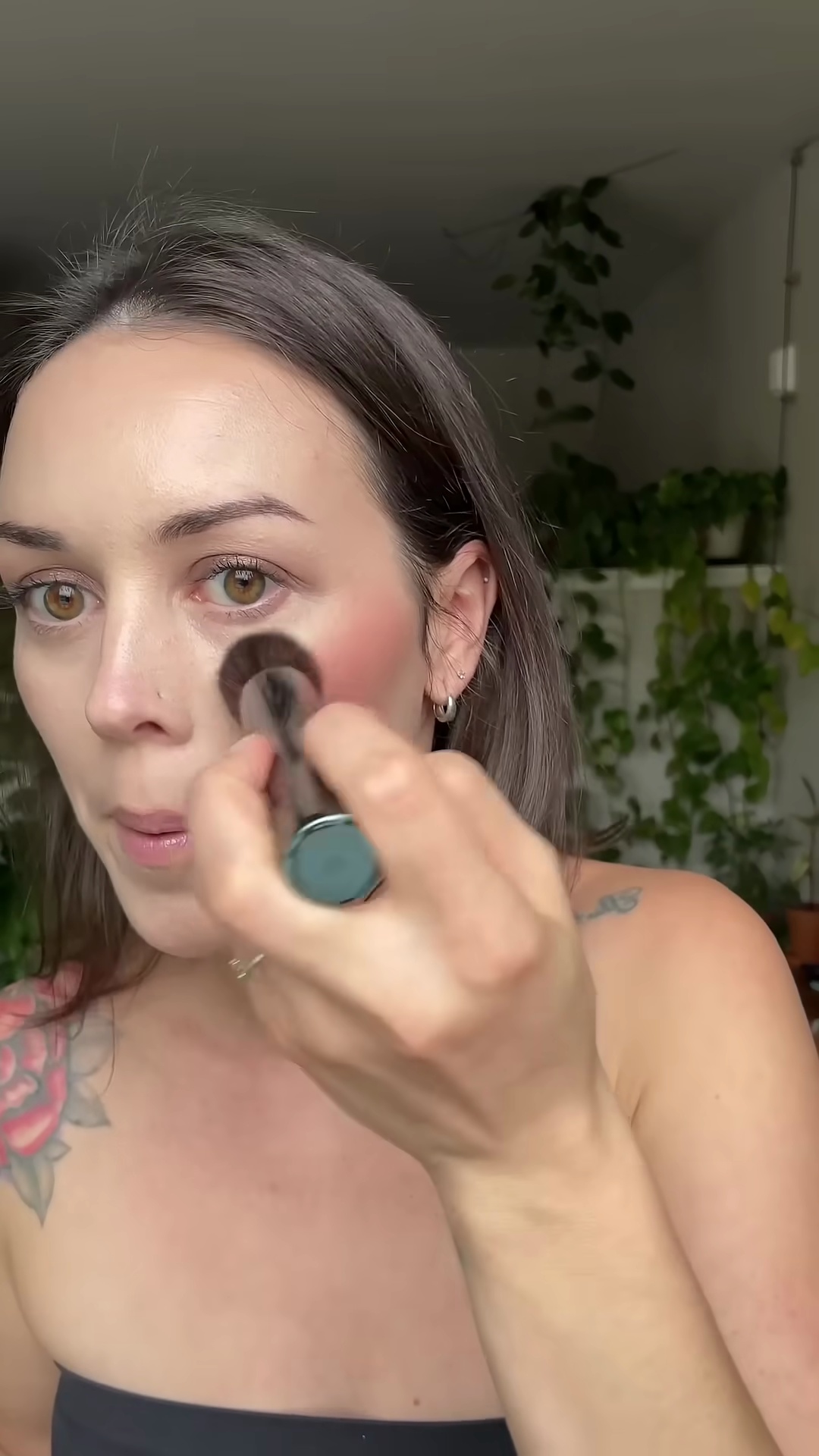 Finished cheek application showing Copper Spice blush on fair olive skin