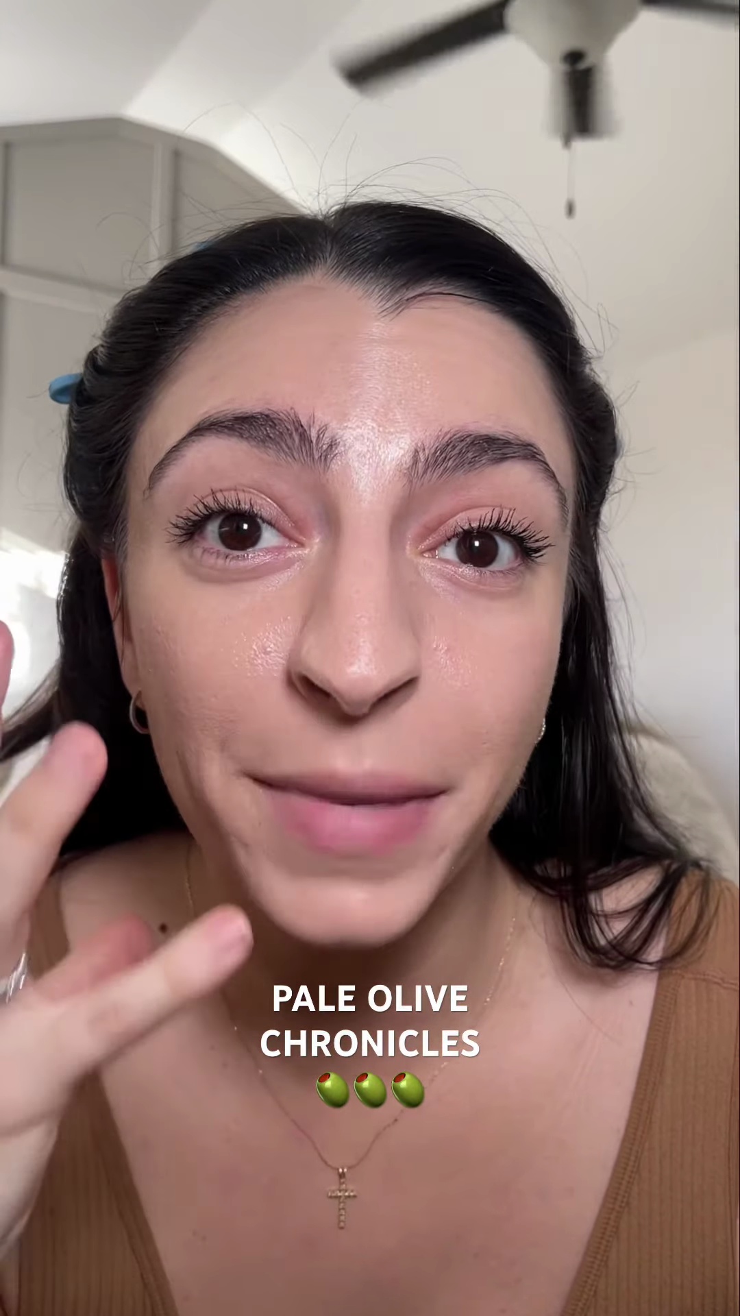 Andreanna pointing out the slight peachy tone of foundation compared to her neck