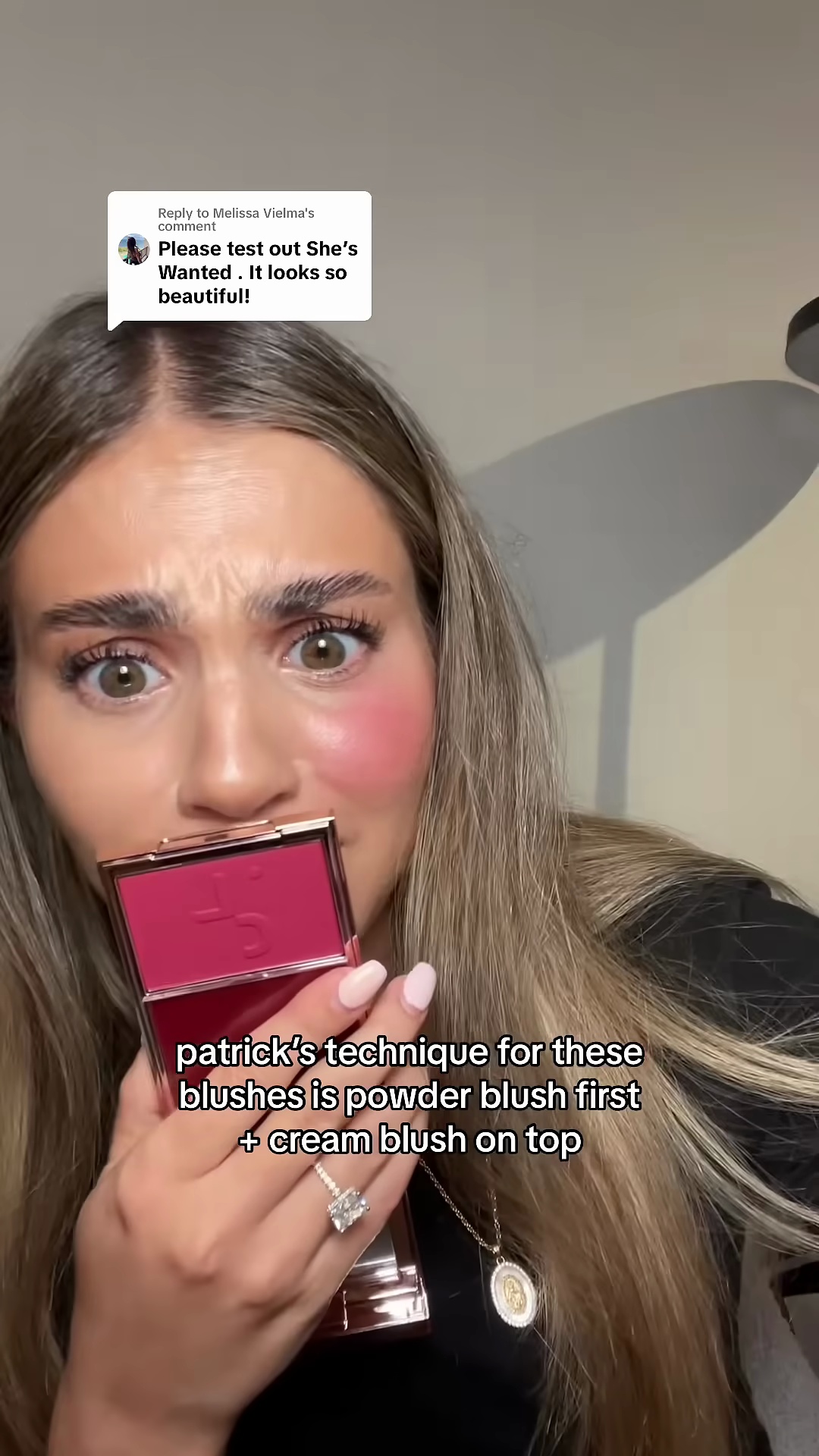 Patrick Ta powder blush swatch showing rich berry pigment on fair skin