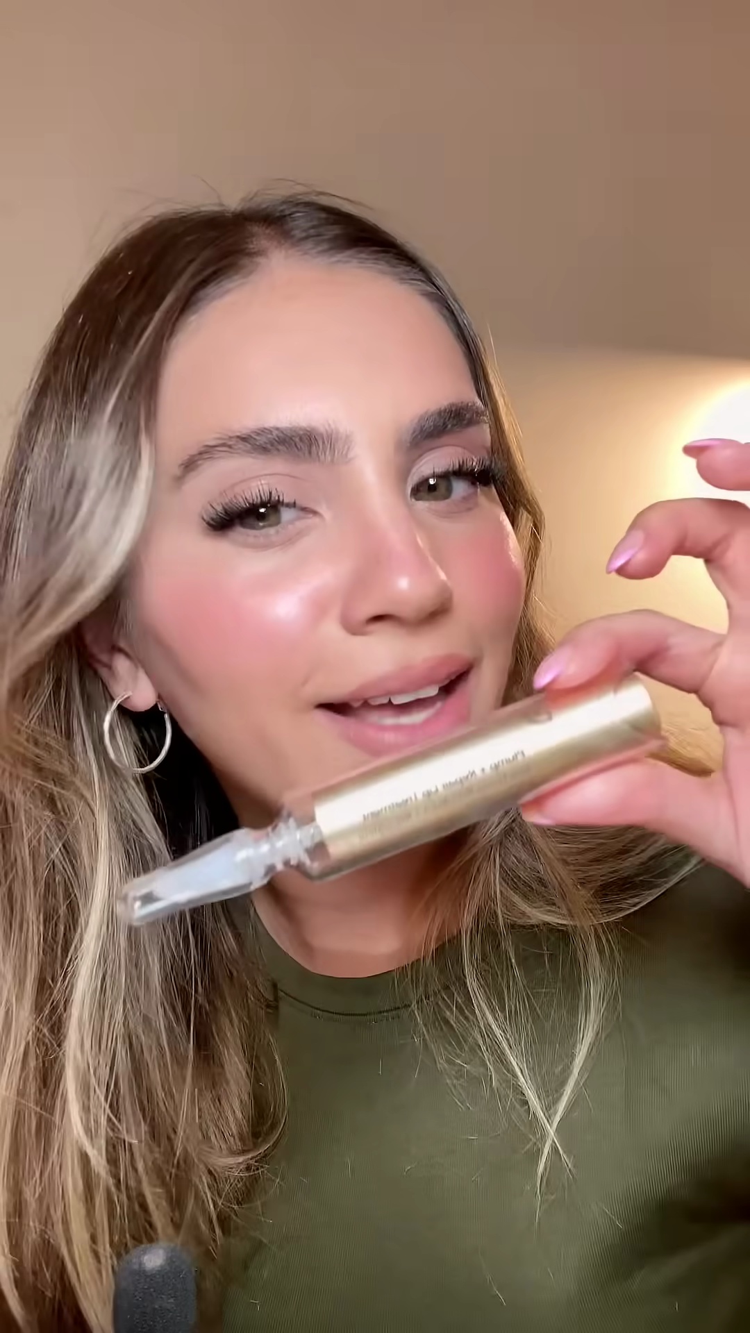 Close-up of Dr. Dennis Gross Plump Repair Lip Treatment showing the syringe-style applicator