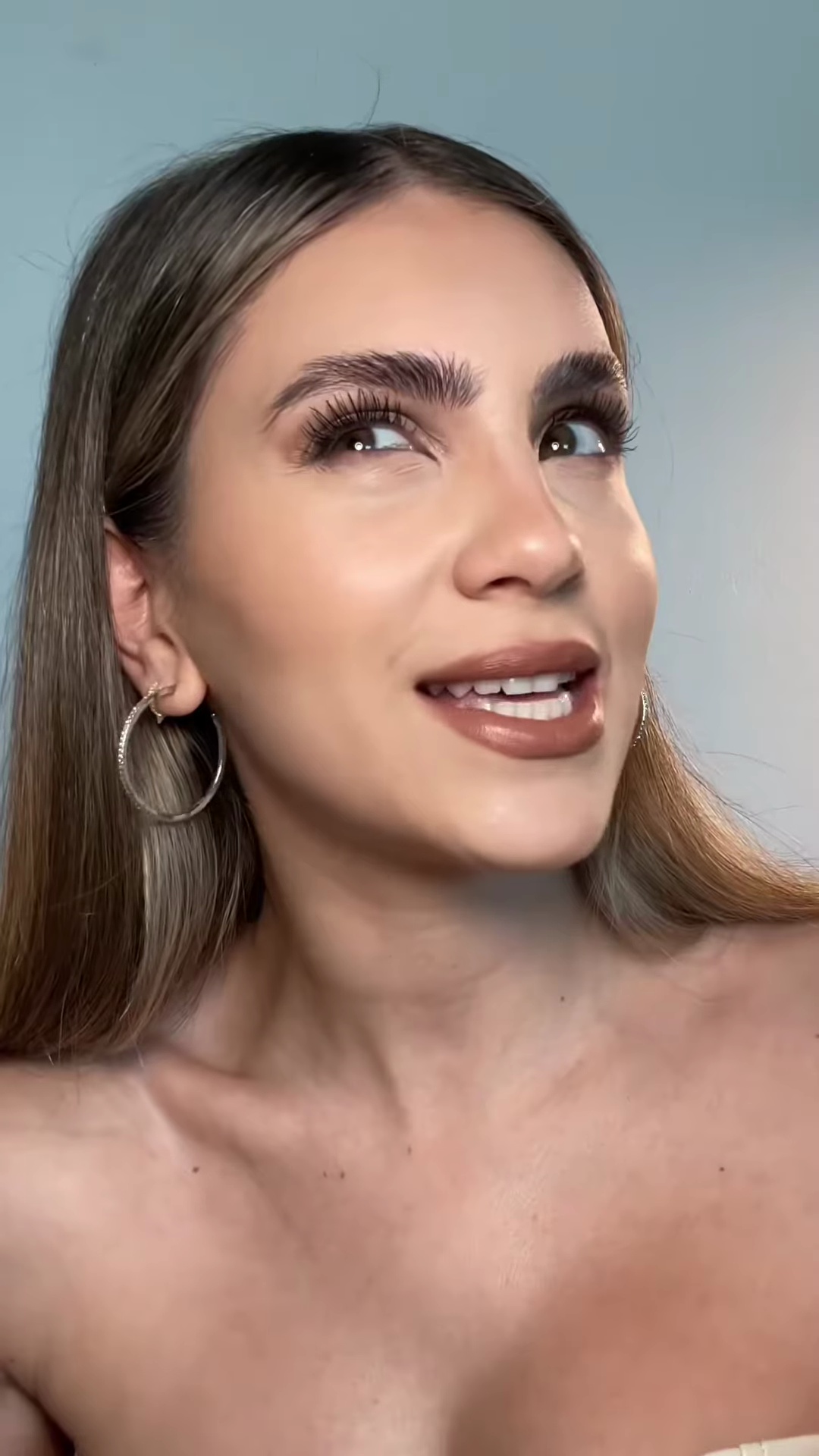 Completed foundation application showing seamless match on light olive skin tone