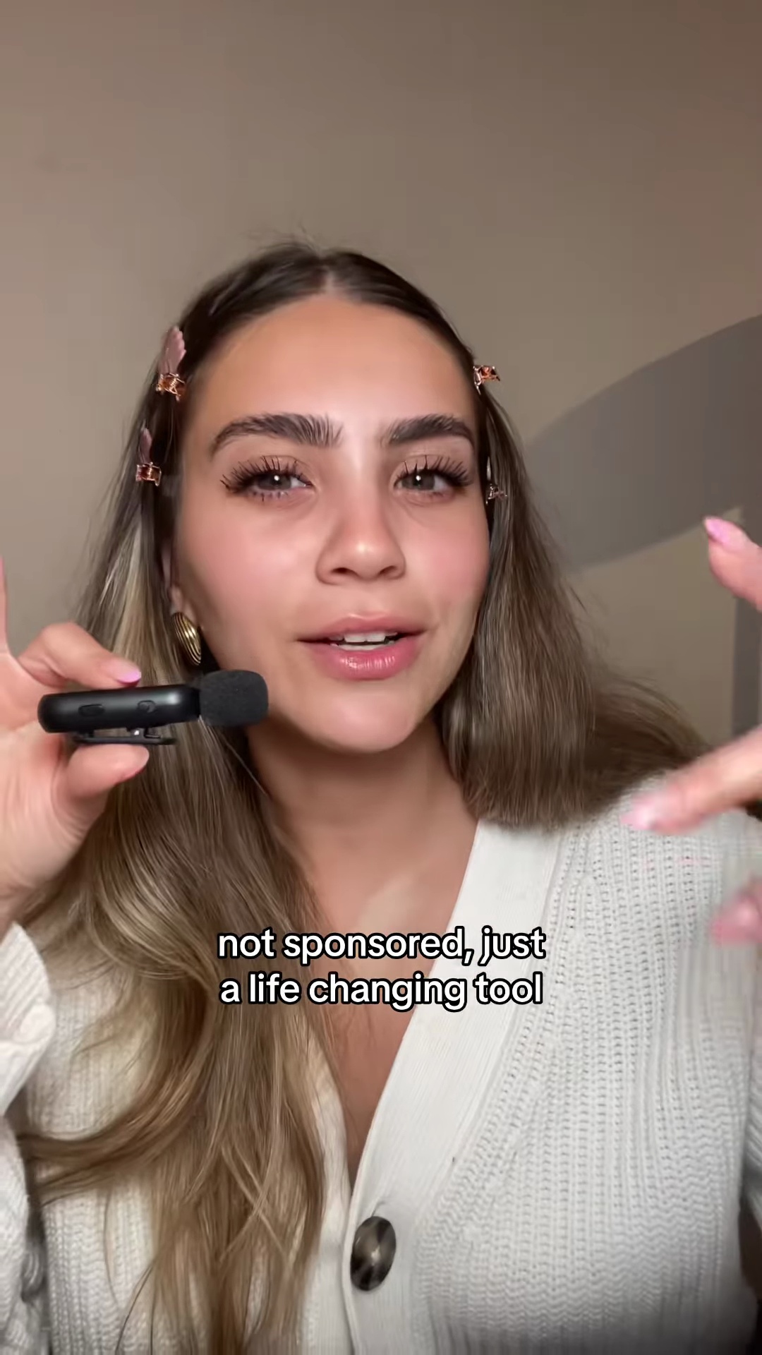 Creator holding phone showing foundation matching website with shade recommendations