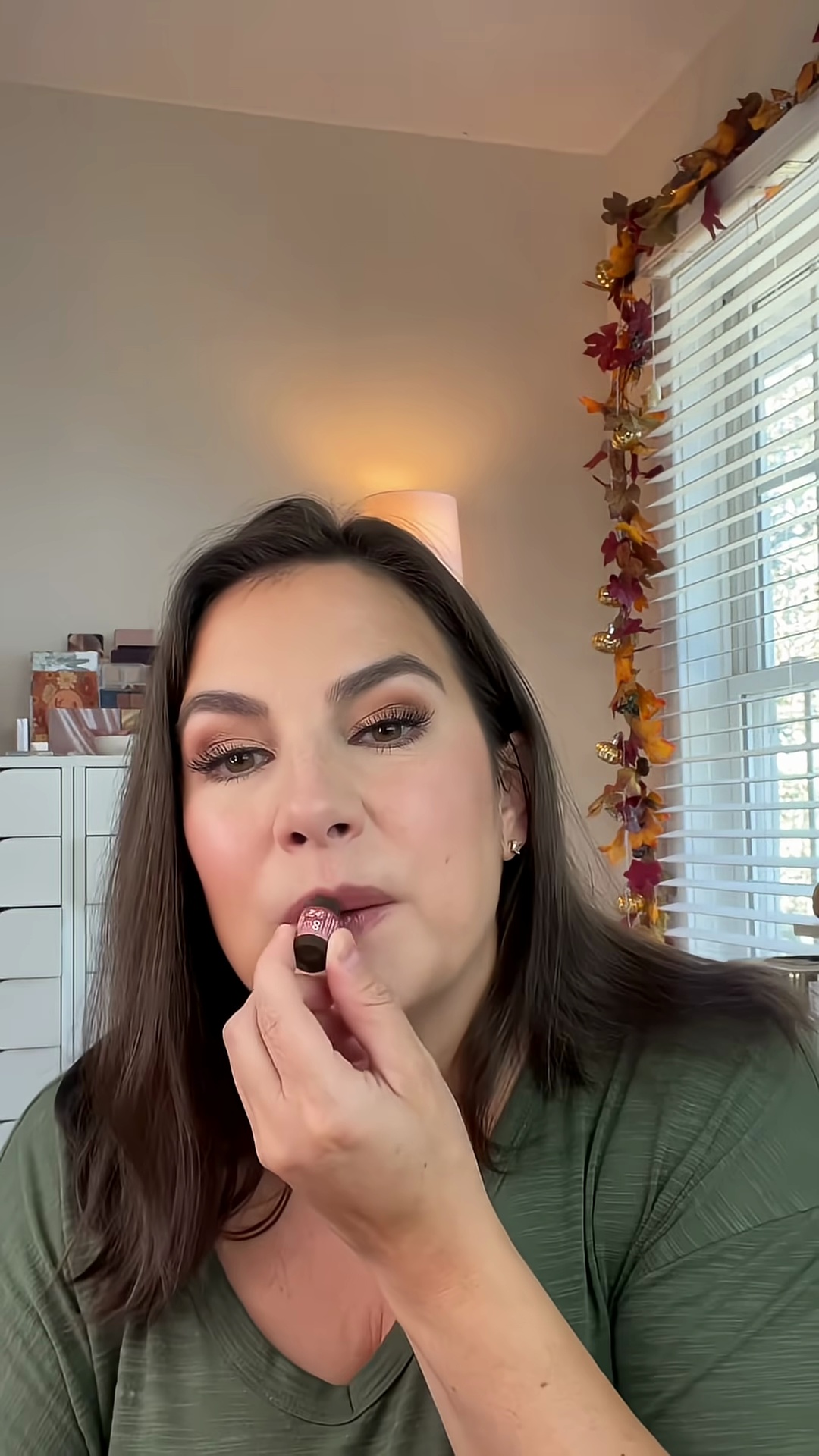 Layering the lip balm to show buildable color intensity