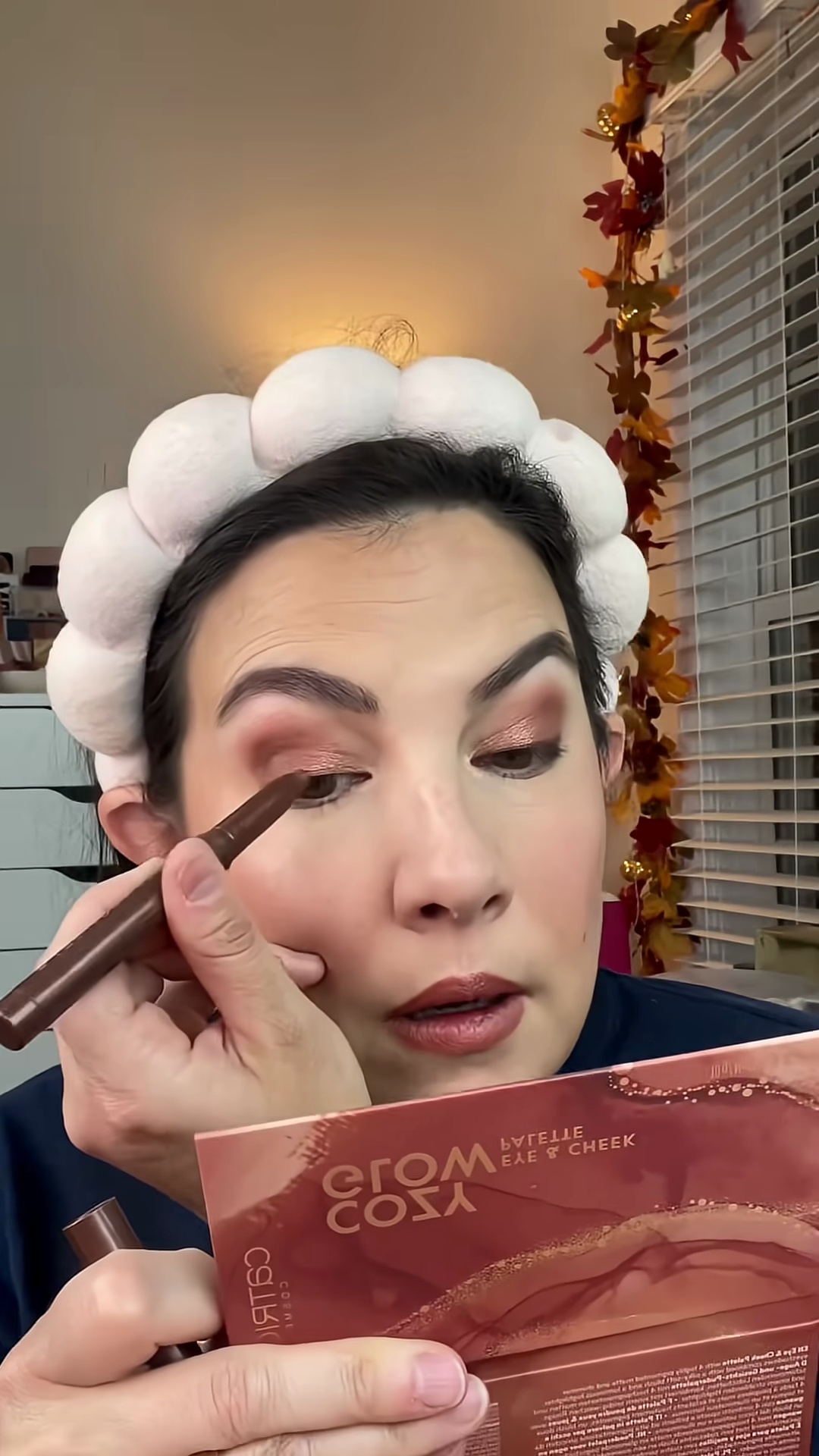 Emily Noel applying eyeliner and showing finished makeup look with Krice palette