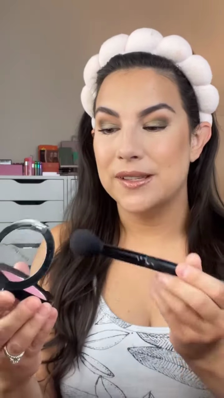 Emily Noel showcasing Wet n Wild Pinch Me Pink blush product