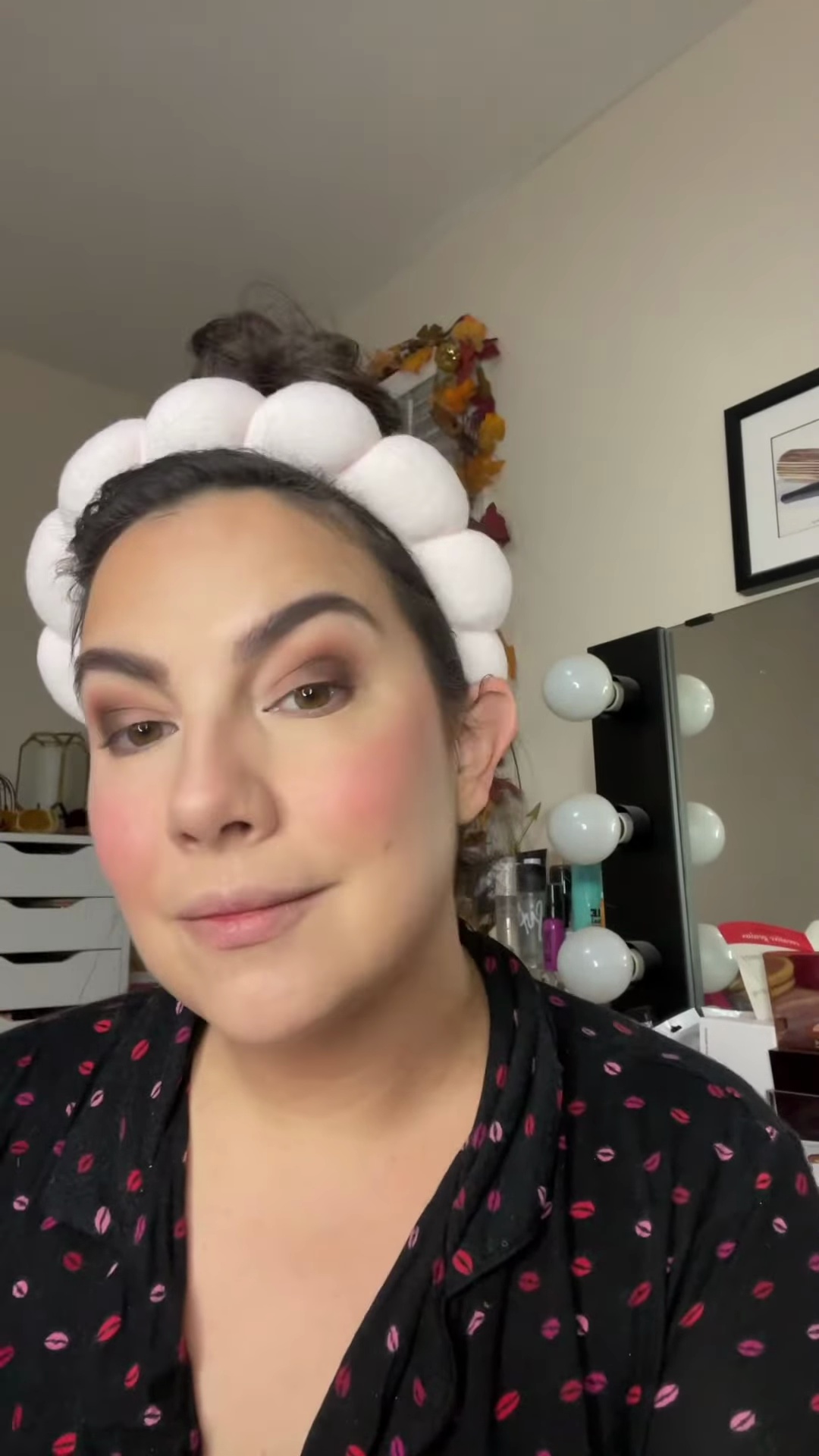 Emily applying matte eyeshadow to lower lash line for definition