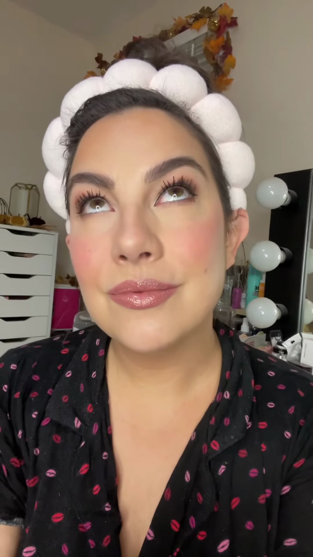 Emily showing completed matte eye look with eyeliner and mascara applied