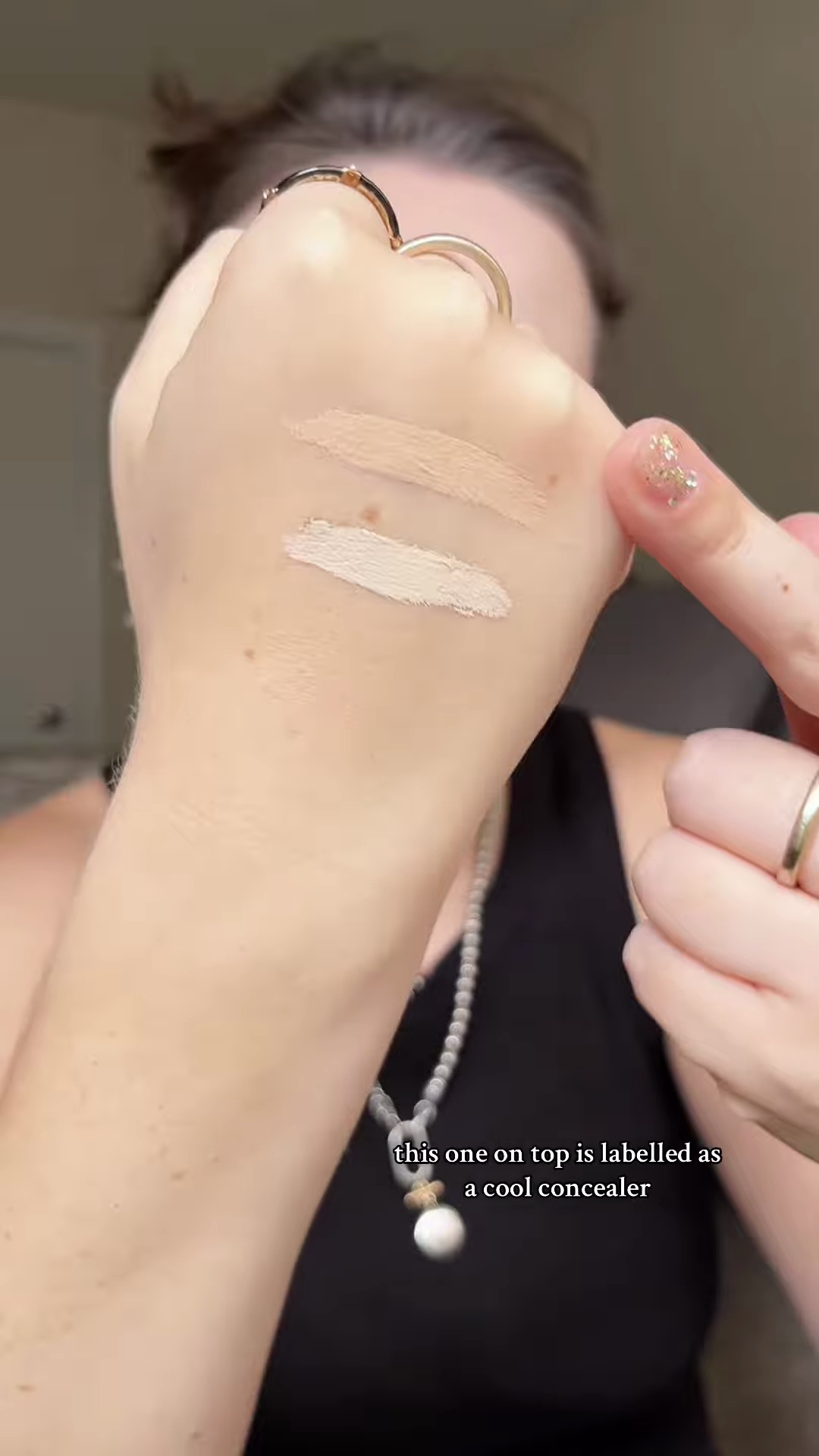 Two concealer swatches side by side showing olive versus cool undertone differences