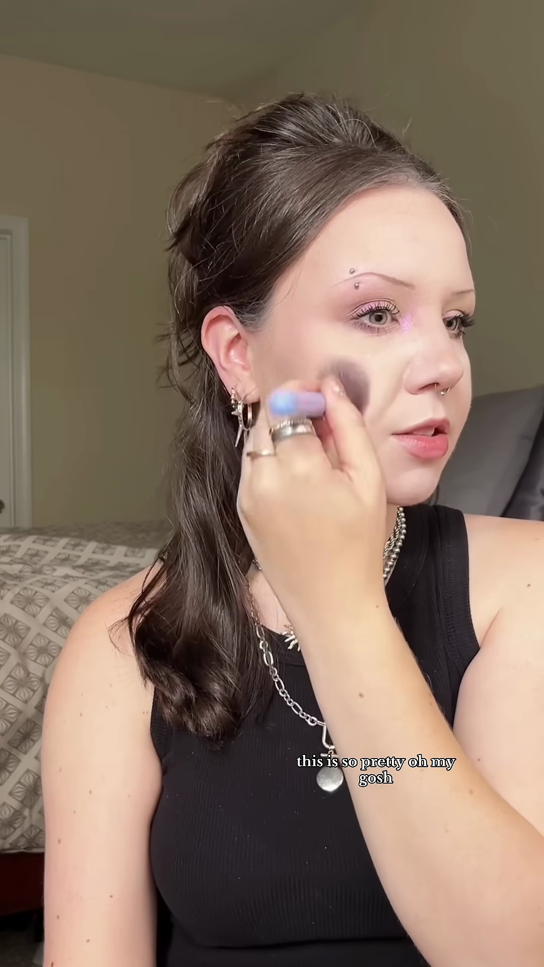 Creator's cheek showing the first application of Pale Rose blush on fair olive skin