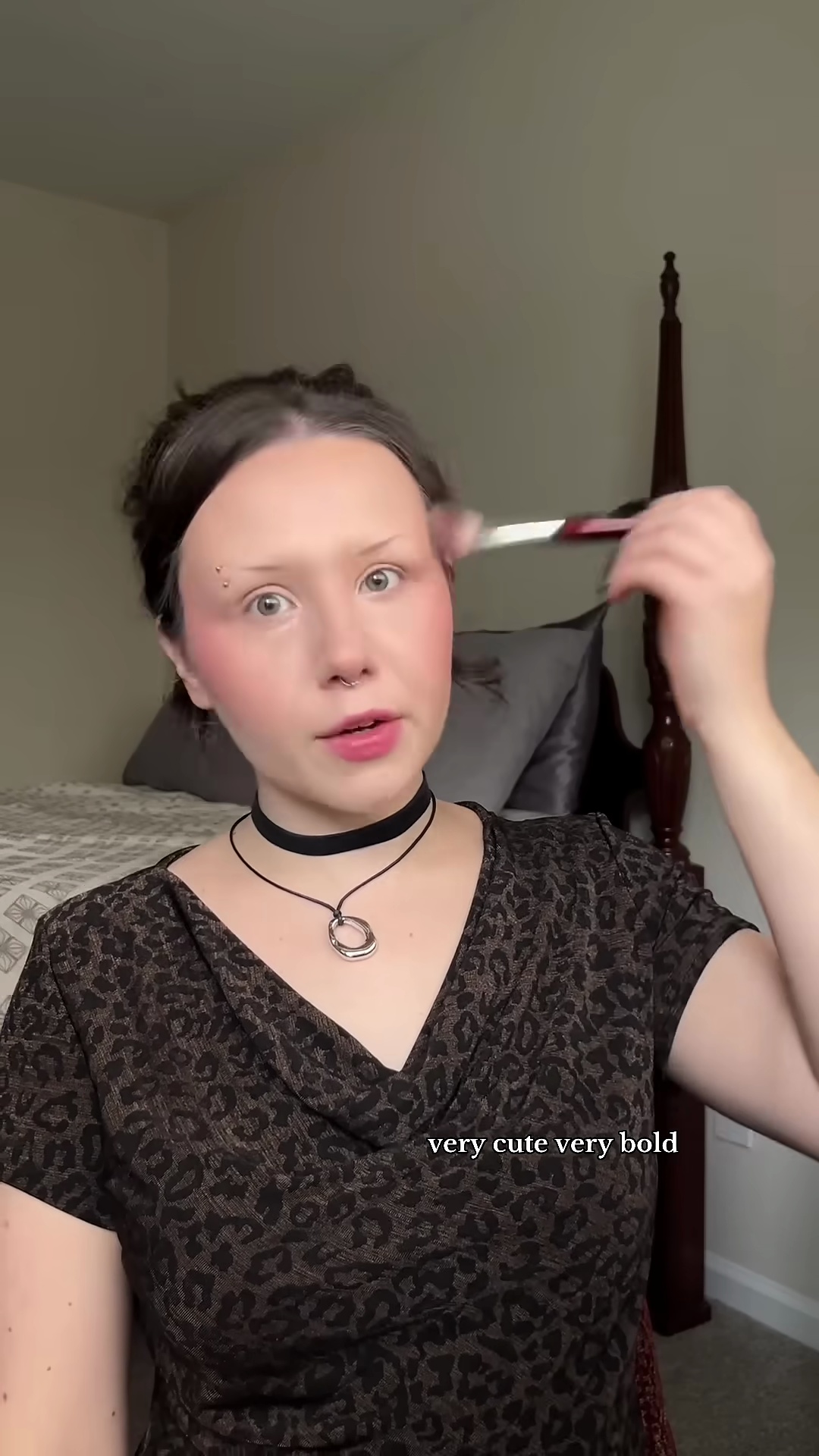 Full face makeup look featuring dramatic red blush on olive skin