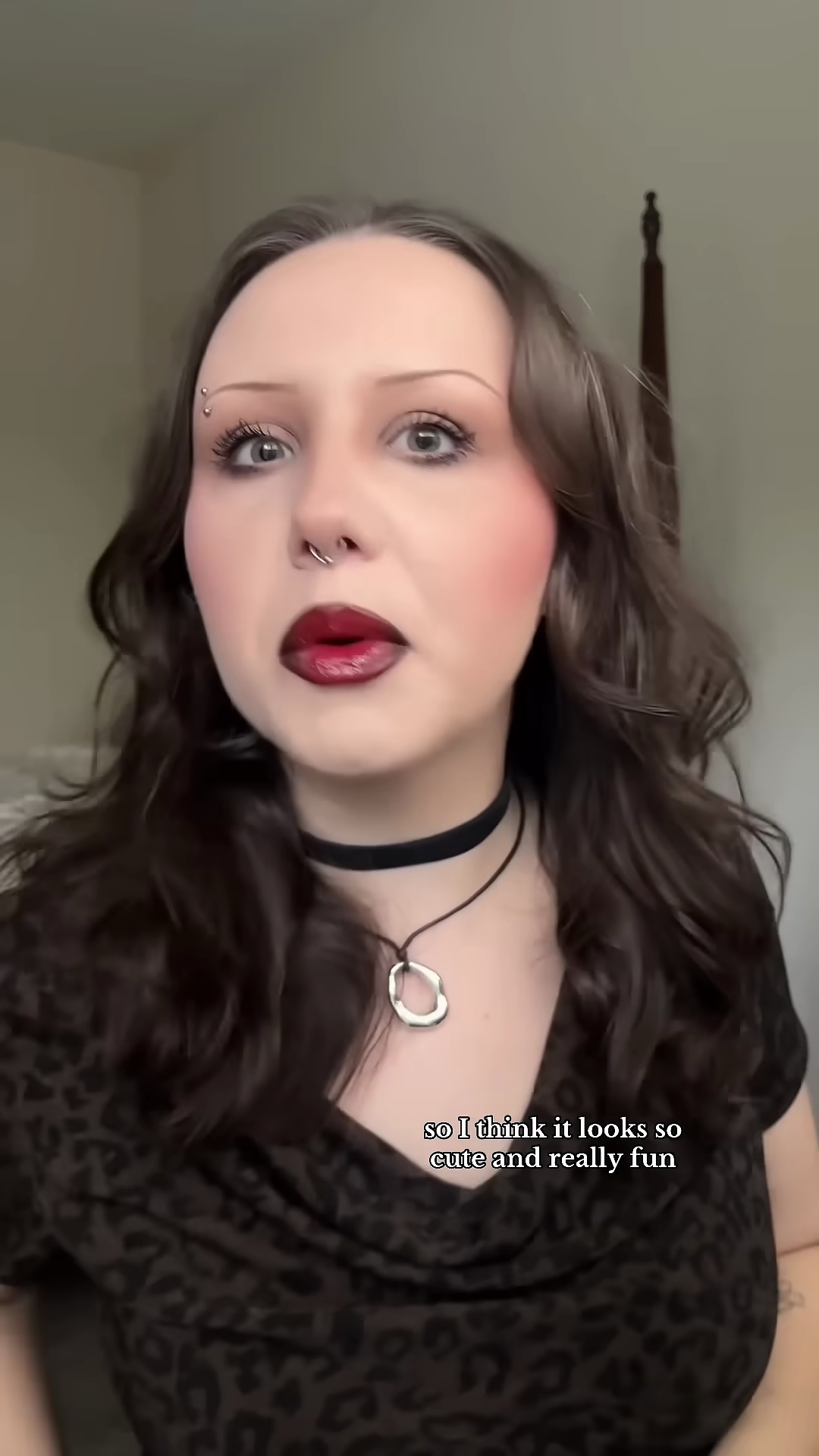 Creator smiling with completed red blush makeup look