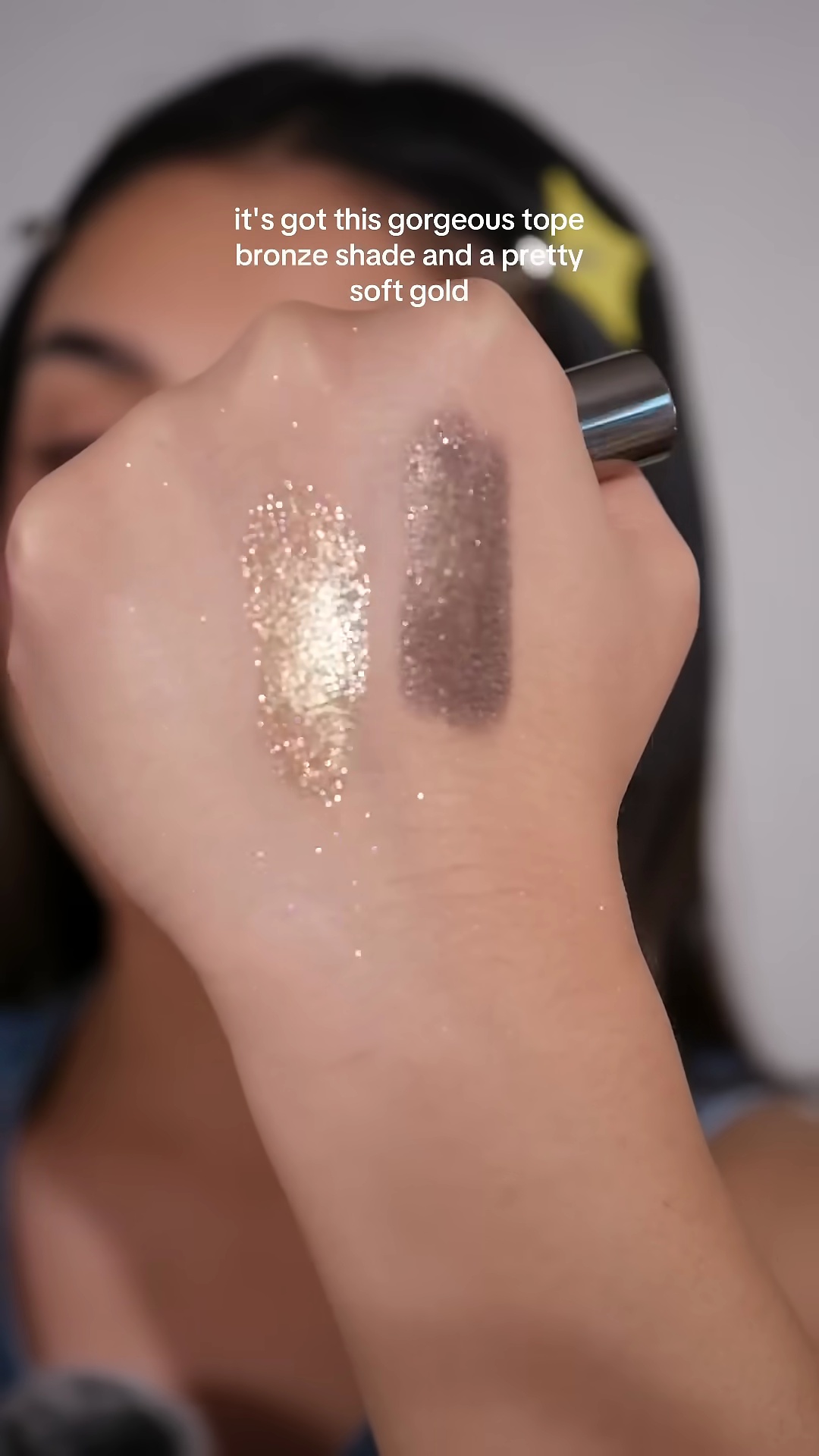 Arm swatches showing the taupey bronze and soft gold pigments from Danessa Myricks Colorfix Stix Duo 4